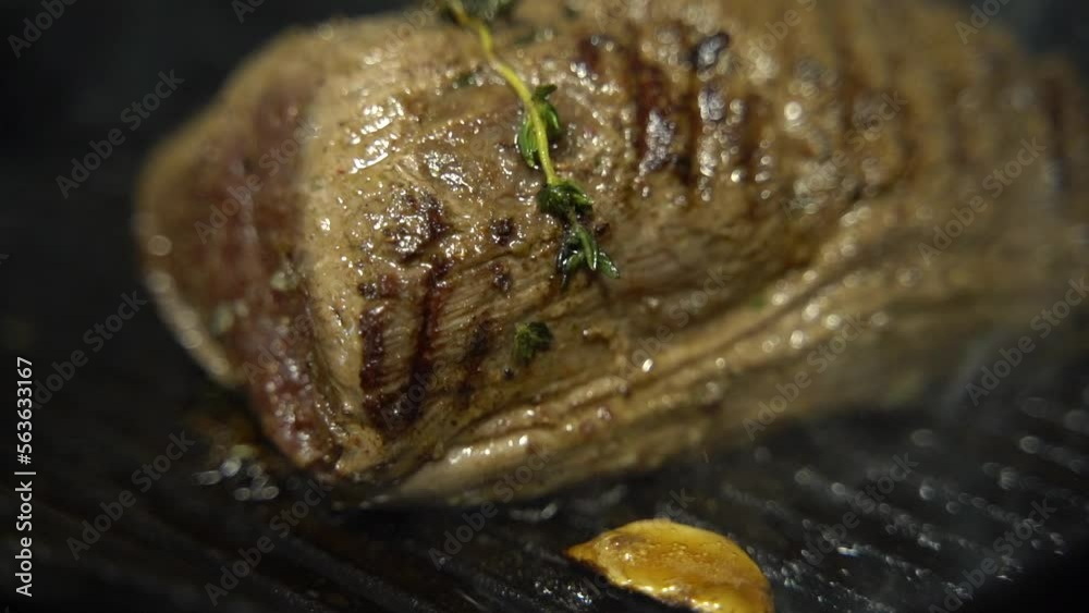 close up slow motion the meat is fried in a pan close up slow motion the meat is fried in a pan