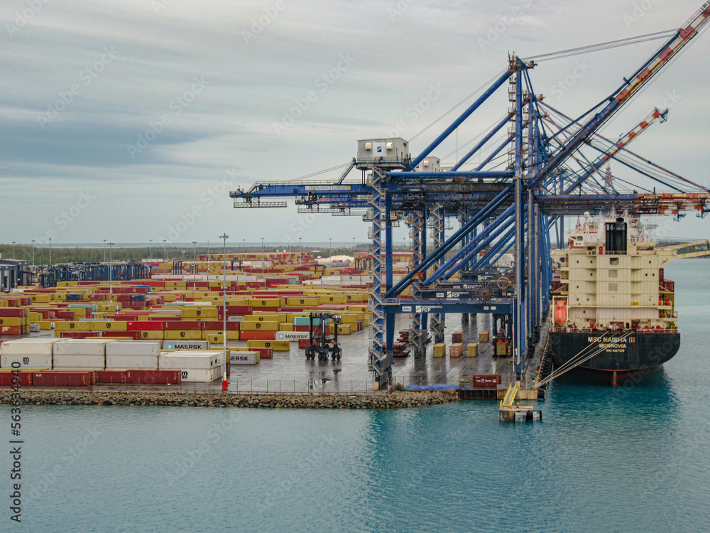 Container Ship docked and being loaded at the Port of Freeport in Freeport, The Bahamas