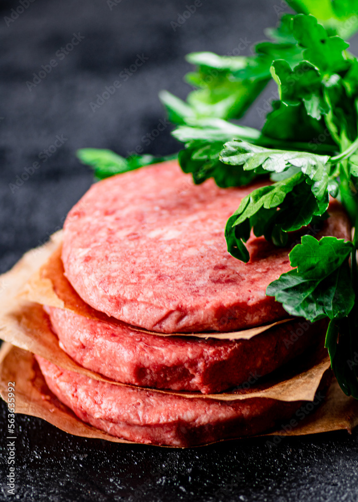 Pile raw burger on the table. Pile raw burger on the table.