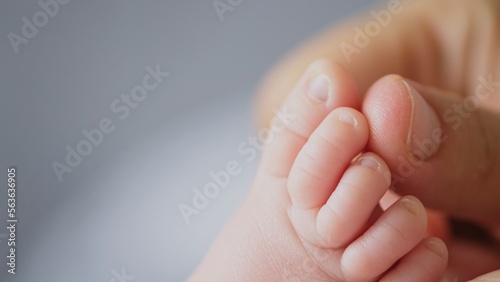 Macro shot of infants toe. Mother touching her small child\'s toes while he is asleep. Slow motion Video of mother touching her sons feet. Mum cares of her infant baby.