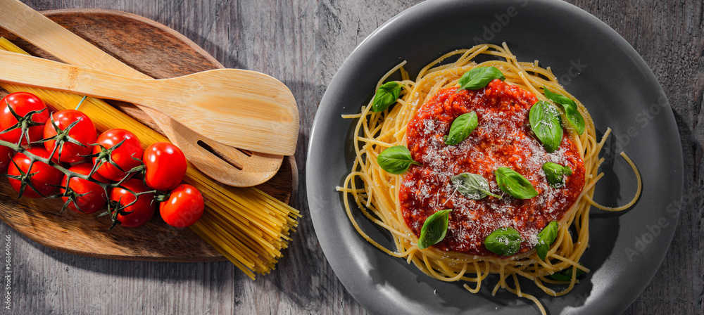 Composition with a plate of spaghetti bolognese Composition with a plate of spaghetti bolognese