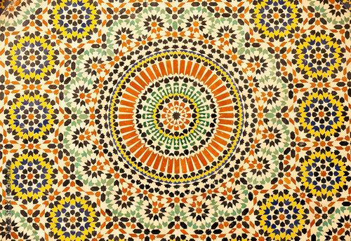 textures of ancient moroccan ceramic mosaic with geometric and floral pattern © minoandriani