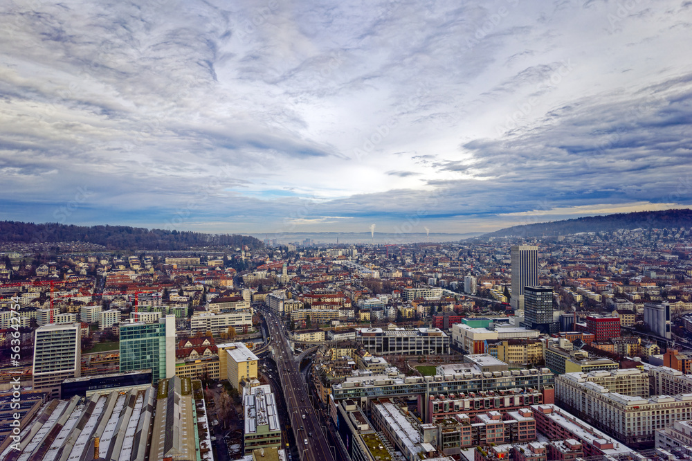 Aerial view of City of Zürich seen from industrial district with North District in the background on a cloudy winter day. Photo taken December 20th, 2022, Zurich, Switzerland.