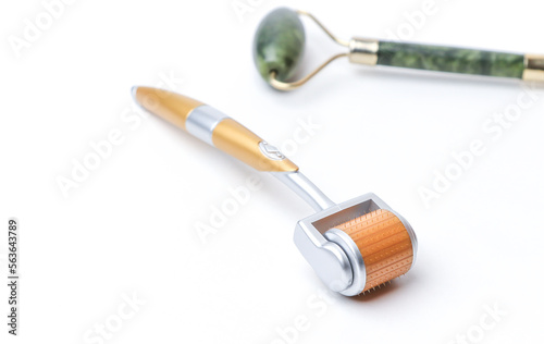 Wallpaper Mural Two different massage rollers for face on white background. Selfcare, skincare concept. 
 Torontodigital.ca