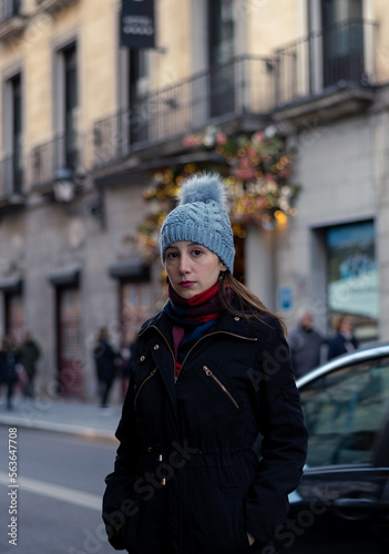 Young woman enjoying a cold and sunny winter day in Madrid Spain