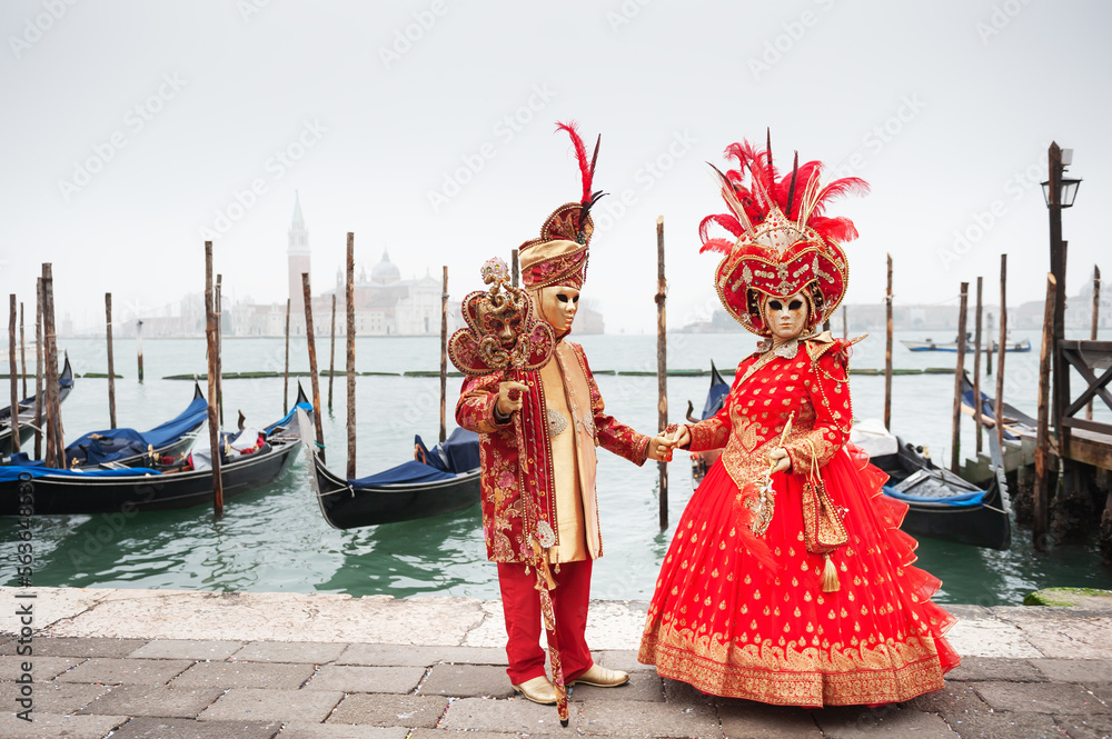 Beautiful colorful masks at traditional Venice Carnival in Venice, Italy