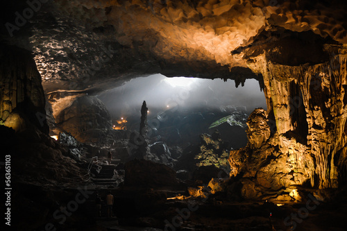 large foggy illuminated underground cave in limestone rock in vietnam