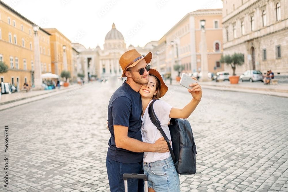 Happy Young couple taking selfie portrait with smartphone mobile outdoor. Tourism, friendship, youth and weekend activities concept