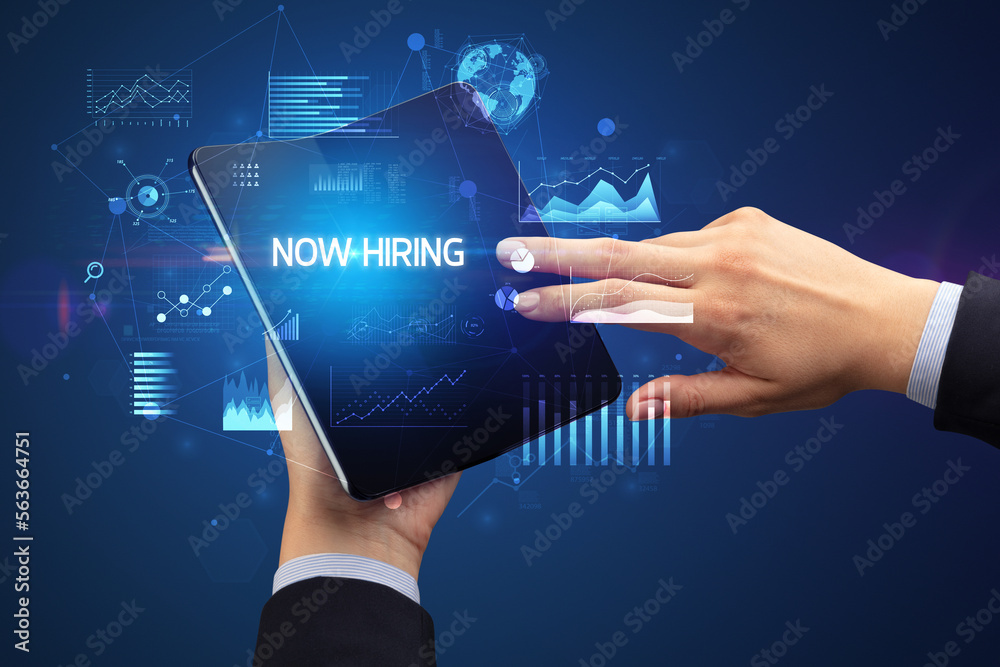 Businessman holding a foldable smartphone, business concept