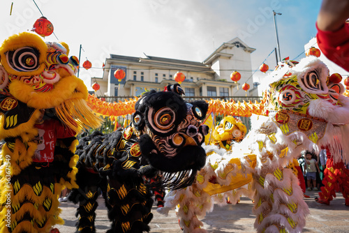 Dragon and lion dance show in chinese new year festival (Tet festival ), lion Dance - dragon and lion dance street performances in Vietnam. Selective focus. photo