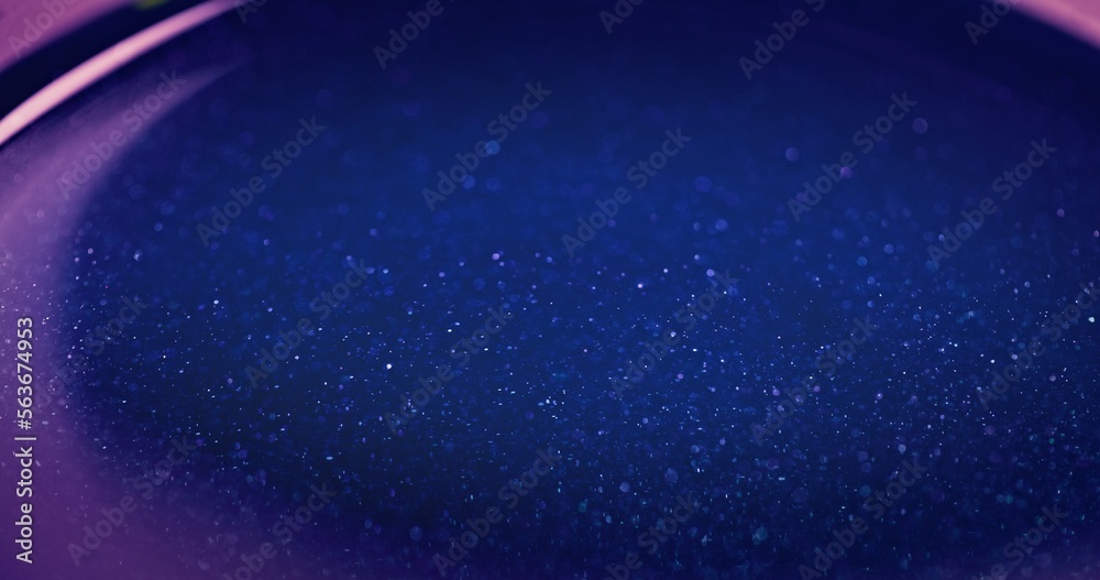 Obraz premium Blur glitter overlay. Color bokeh glow. Cosmic star dust. Defocused neon blue pink color light flare shiny grain texture futuristic abstract background with free space.