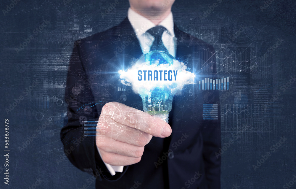 Businessman holding a light bulb, business concept Businessman holding a light bulb, business concept