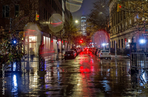 Street lights and brake lights on a rainy night in New York City.