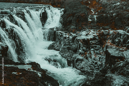 waterfall on the rocks with frozen rocks