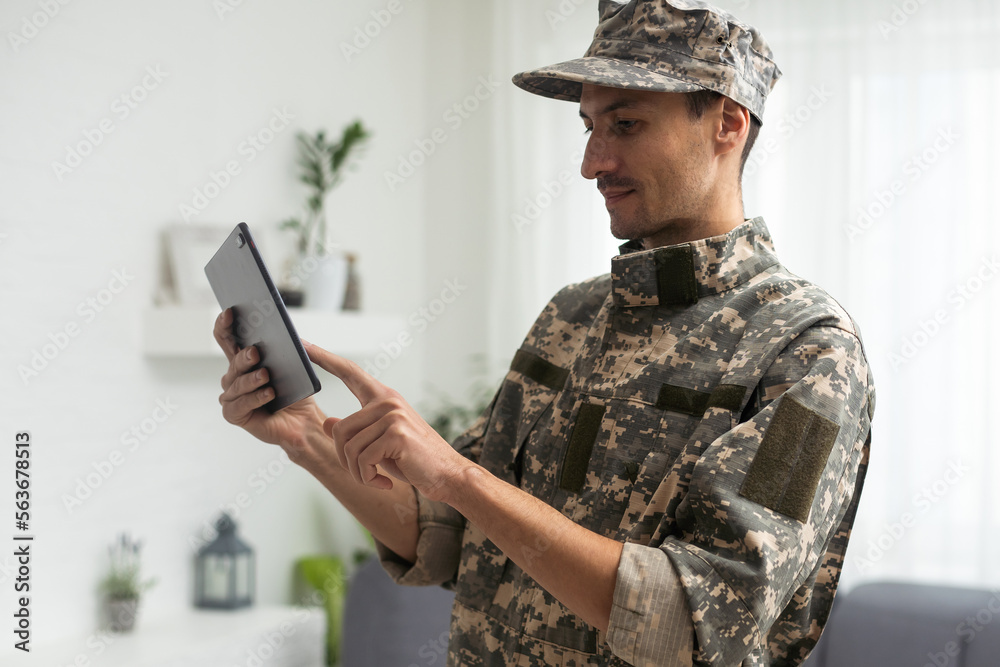 Image of army soldier using digital tablet against white background. Image of army soldier using digital tablet against white background.