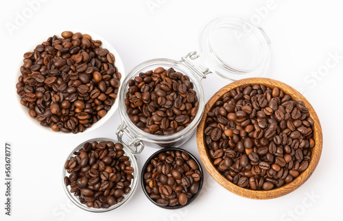 Coffee beans in bowl isolated on white background.