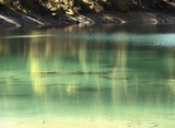 Teal waters of Lake Cauma, jewel of the Swiss Canton of Grisons