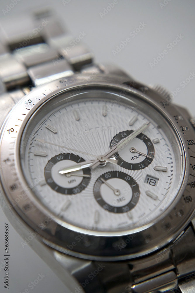 Elegant silver and white wrist watch with metal details Elegant silver and white wrist watch with metal details