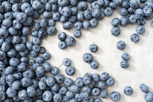 Fresh blueberries on gray background. Blueberries background. Healthy berry, organic food, antioxidant, vitamin, blue food.