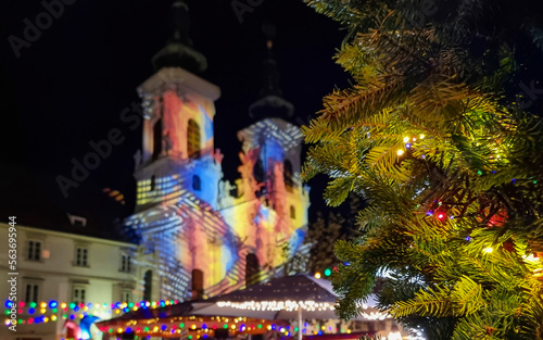 Beautiful Christmas decorations and Mariahilfer church   at night  in the city center of Graz  Styria region  Austria