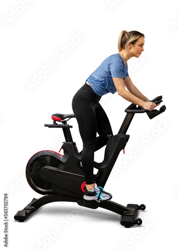 Woman exercising on a spin bike isolated on white background