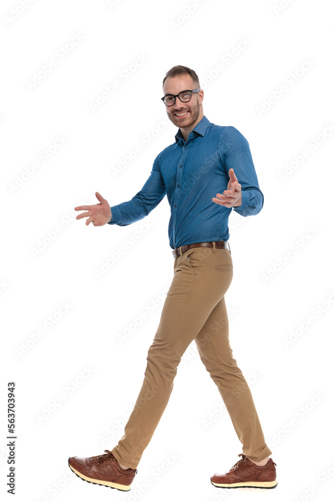 handsome nerdy man with glasses walking, smiling and gesturing handsome nerdy man with glasses walking, smiling and gesturing