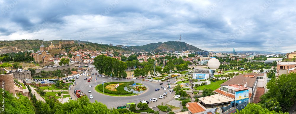 Panoramic view of Tbilisi Old Town and Avlabari district with Europe Square, Rike park, Metekhi Church on bank of Kura river and Narikala Fortress.
