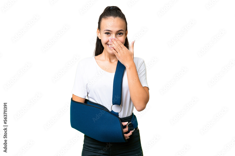 Young Arabian woman with broken arm and wearing a sling over isolated chroma key background happy and smiling covering mouth with hand Young Arabian woman with broken arm and wearing a sling over isolated chroma key background happy and smiling covering mouth with hand