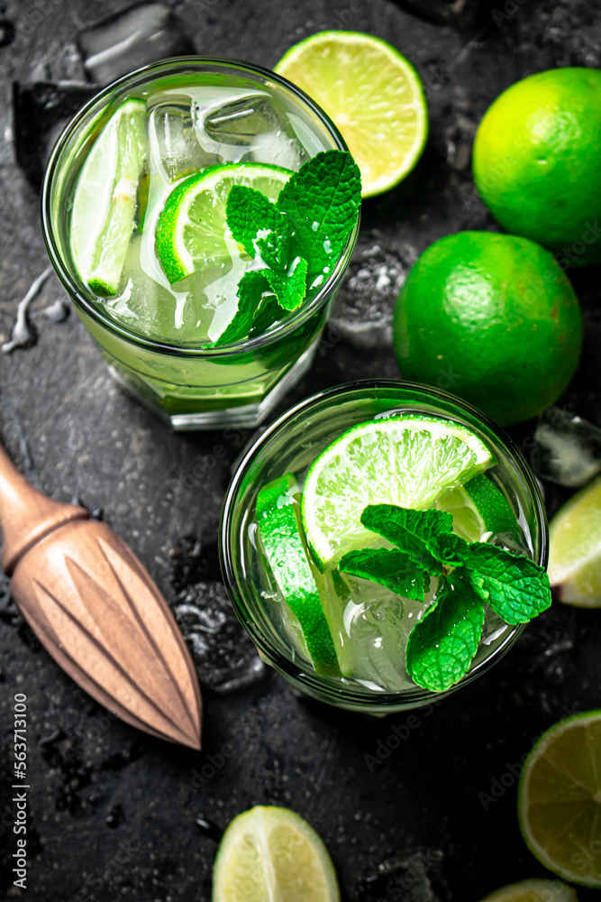Traditional mojito with pieces of lime and mint. 