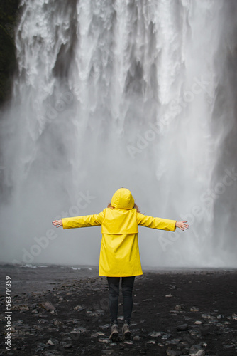Amazing Waterfall in Iceland, Sunny Day, Golden Circle Woman in Yellow Coat 