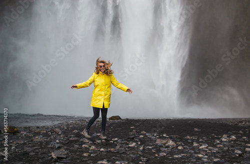 Amazing Waterfall in Iceland  Sunny Day  Golden Circle Woman in Yellow Coat 