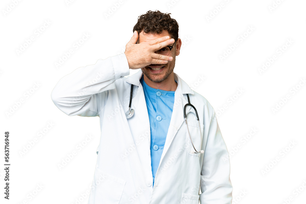 Brazilian doctor man over isolated chroma key background covering eyes by hands and smiling Brazilian doctor man over isolated chroma key background covering eyes by hands and smiling