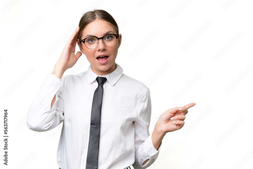 Young business caucasian woman over isolated background surprised and pointing finger to the side Young business caucasian woman over isolated background surprised and pointing finger to the side