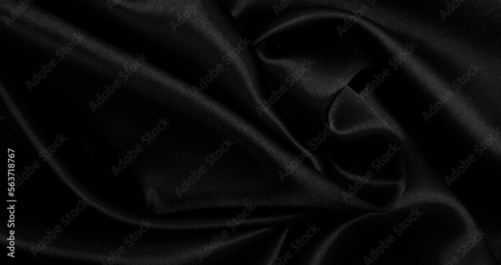 Obraz premium Smooth elegant black silk or satin luxury cloth texture as abstract background. Luxurious background design