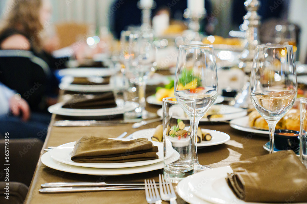 a festive served table with snacks and tableware. a festive served table with snacks and tableware.