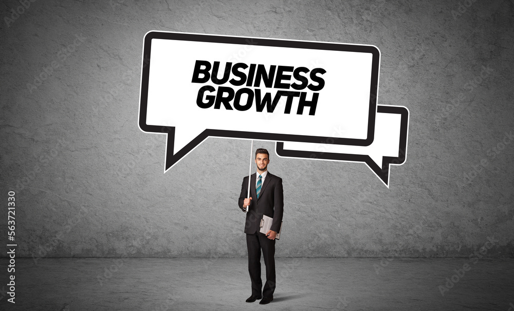 business person in casual holding road sign business person in casual holding road sign