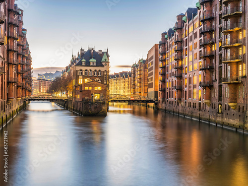 The Warehouse District Speicherstadt, Hamburg, illuminated after sunset, Wandrahmsfleet, Germany