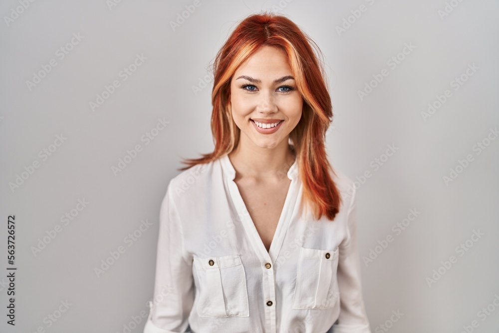 Young caucasian woman standing over isolated background with a happy and cool smile on face. lucky person. Young caucasian woman standing over isolated background with a happy and cool smile on face. lucky person.