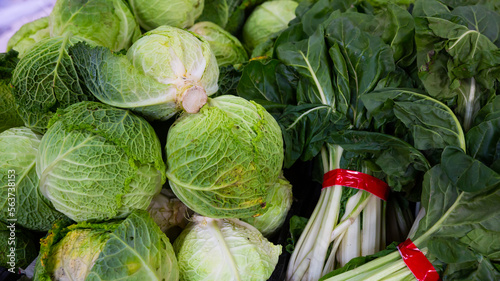 Image of fresh organic salad and cabbage in greengrocery shop
