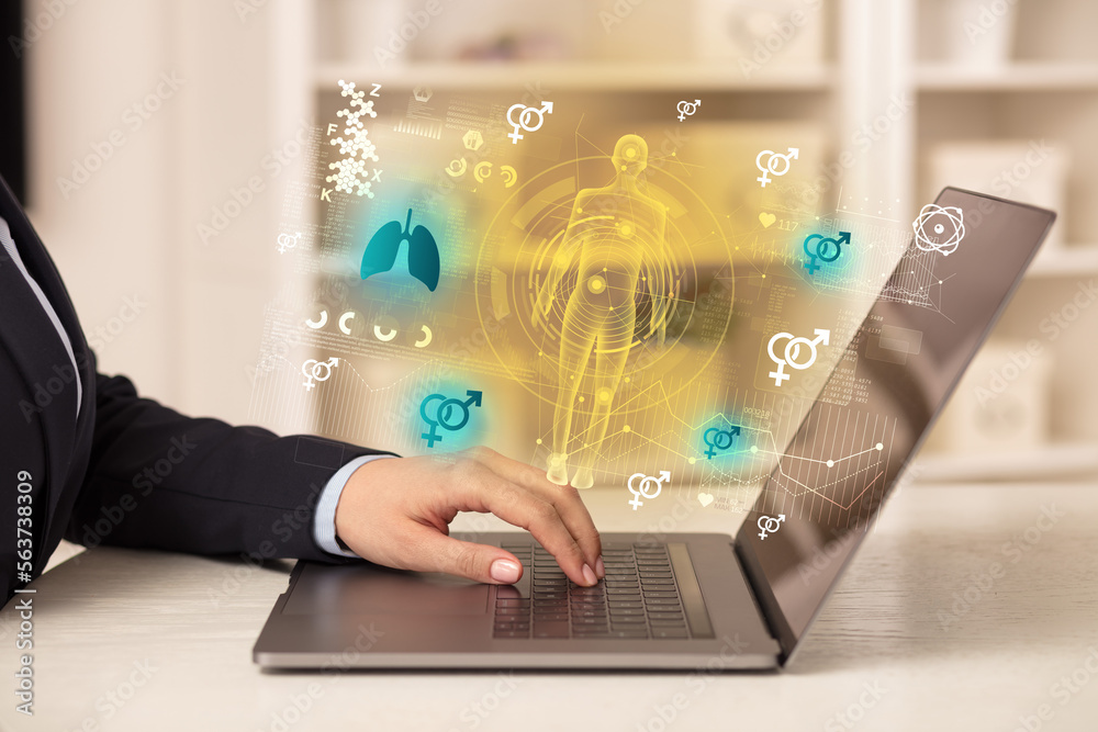 Doctor working on laptop with healthcare concept Doctor working on laptop with healthcare concept