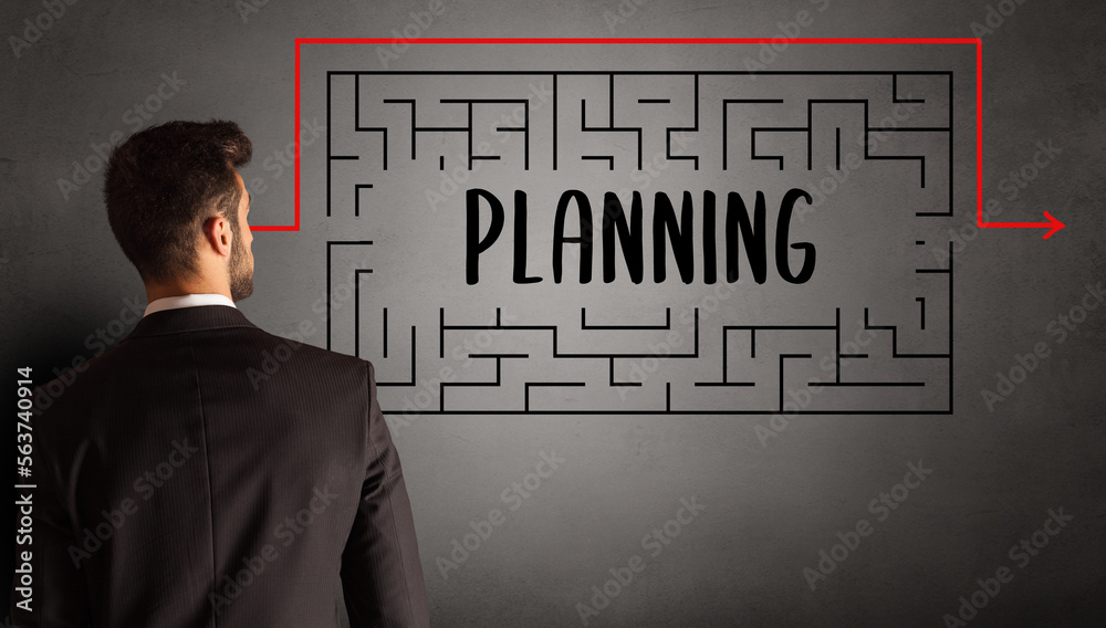 businessman drawing maze concept businessman drawing maze concept