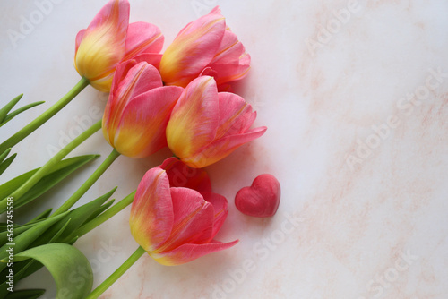 Fototapeta Naklejka Na Ścianę i Meble -  greeting card happy valentine's day. bouquet of tulips and red heart