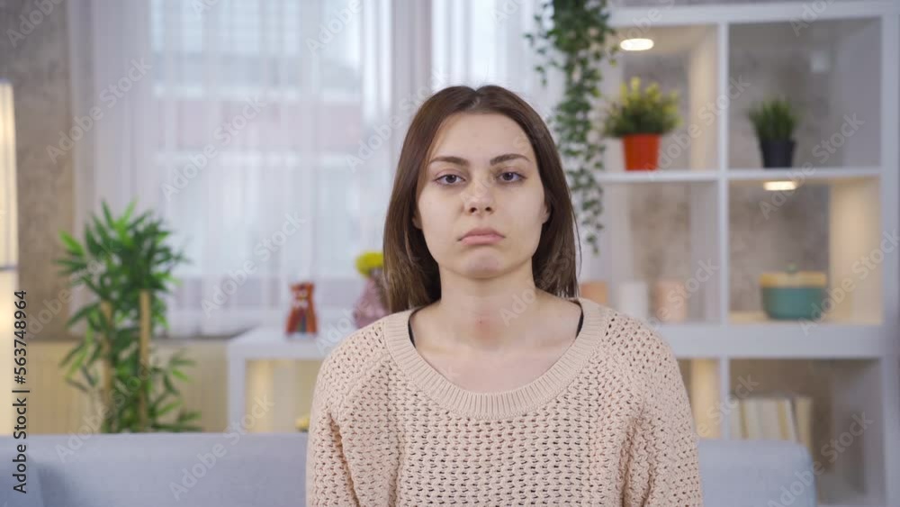 Portrait of unhappy and exhausted young woman.
Young woman sitting on sofa at home looking at camera sad and exhausted.
Portrait of unhappy and exhausted young woman.
Young woman sitting on sofa at home looking at camera sad and exhausted.