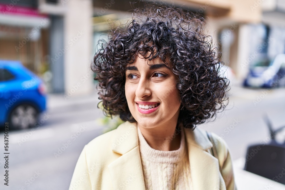 Young middle east woman excutive smiling confident looking to the side at street Young middle east woman excutive smiling confident looking to the side at street