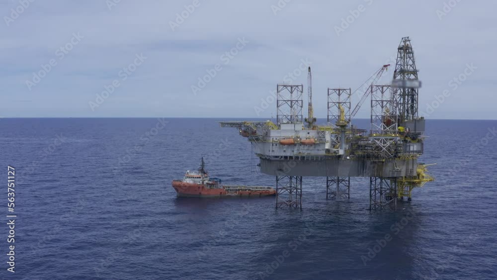 Aerial view from a drone of an offshore jack up rig, oil platform and offshore supply vessels at the offshore location during day time
Aerial view from a drone of an offshore jack up rig, oil platform and offshore supply vessels at the offshore location during day time