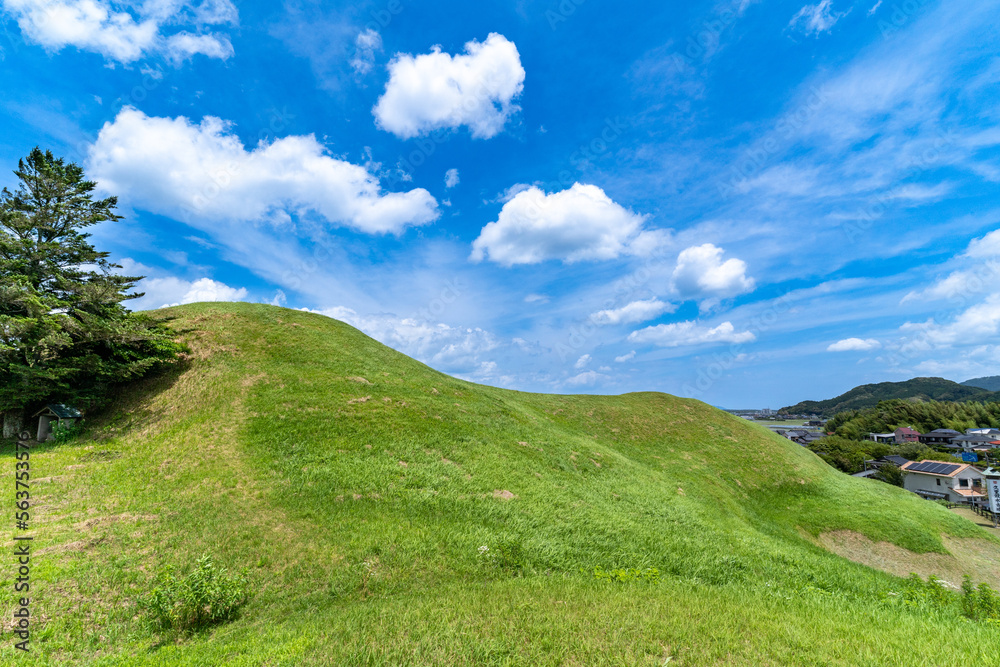 Fototapeta premium Hill - ancient tomb - and blue sky in Saga prefecture, Japan.
