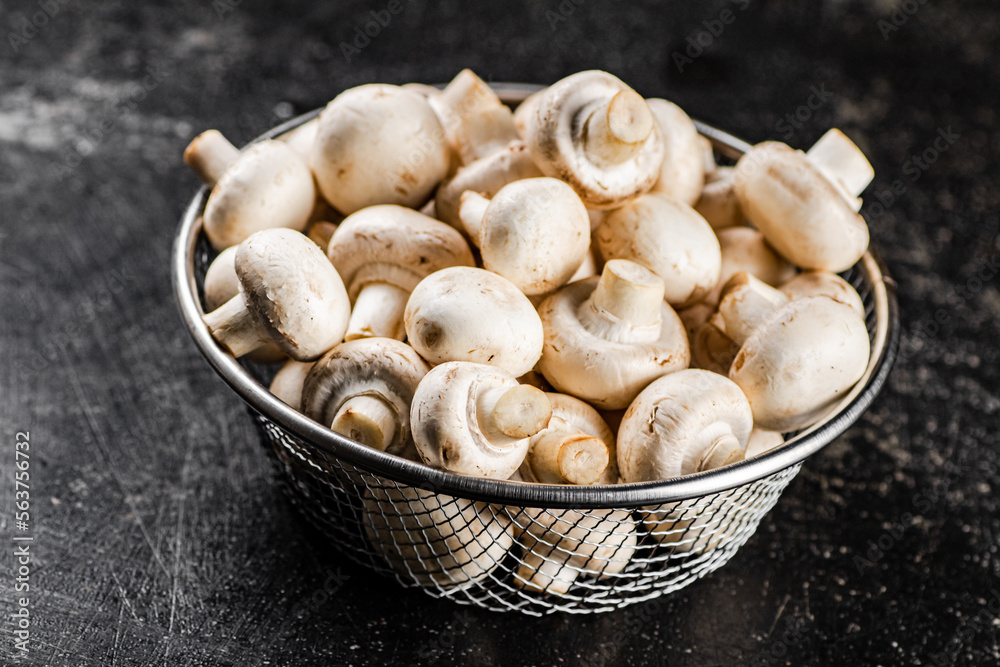 Fresh mushrooms in a colander. Fresh mushrooms in a colander.