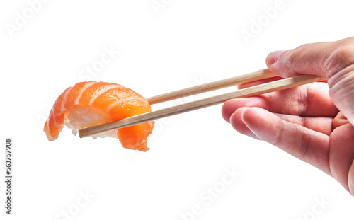  Hand of man holding salmon nigiri with chopsticks over isolated white background