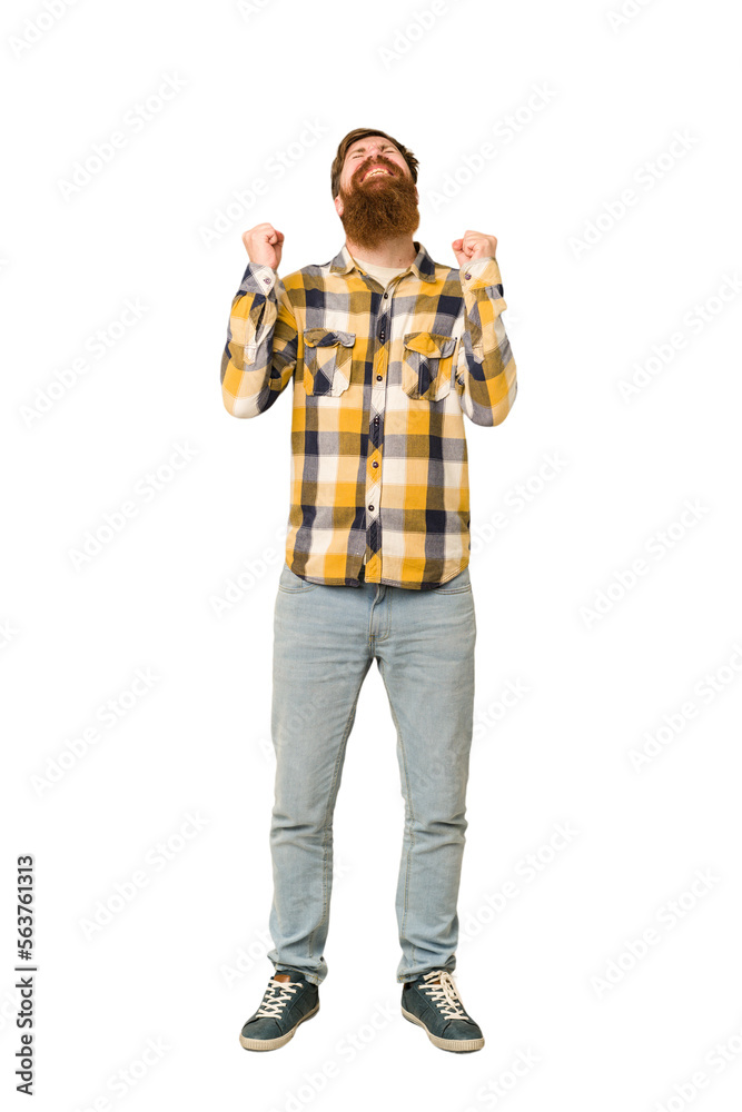 Young adult redhead man with a long beard standing full body isolated celebrating a victory, passion and enthusiasm, happy expression. Young adult redhead man with a long beard standing full body isolated celebrating a victory, passion and enthusiasm, happy expression.