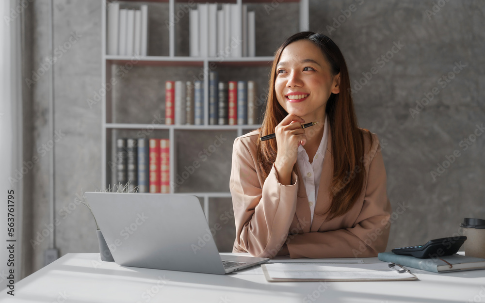 Young asia pretty entrepreneur busy woman in her private office working audit and calculating expense financial annual financial report balance sheet statement, checking inspection tax calculation Young asia pretty entrepreneur busy woman in her private office working audit and calculating expense financial annual financial report balance sheet statement, checking inspection tax calculation